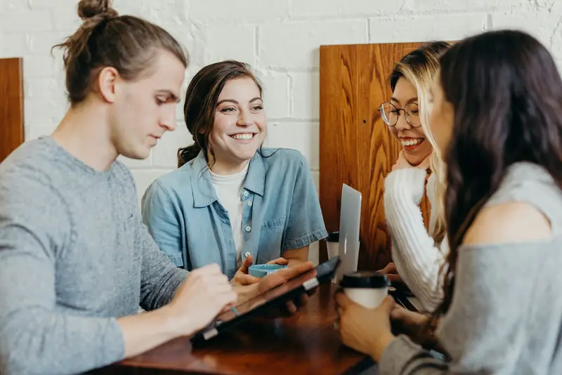 Team collaborating around a tablet