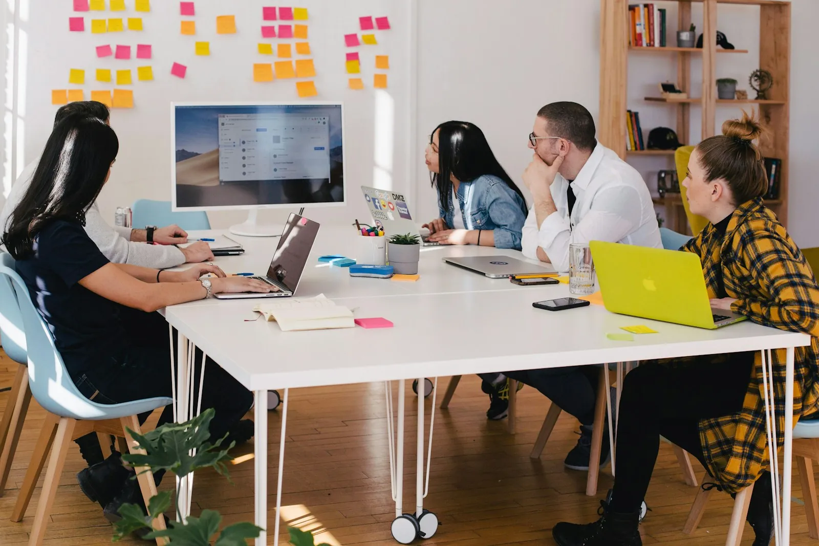 A professional team working together in a bright, modern training room